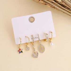 Detailed view of Bohemian gold earring set with sparkling crystals and pearl details
