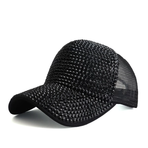 Close-up of black baseball cap featuring sparkling rhinestones and breathable mesh back