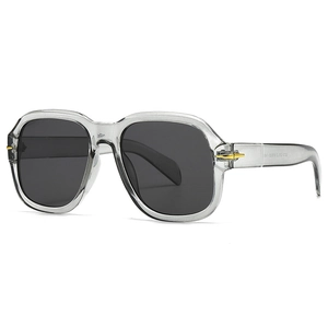 Modern retro flat top square sunglasses in transparent grey with gold hinges and dark lenses