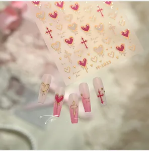 Detail of pink and gold heart nail art stickers M-1033 with chrome crosses and lettering