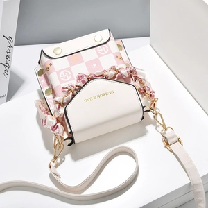 Pink and beige checkered mini crossbody bag with silk scarf handle and gold hardware