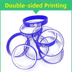 Detail of custom blue and white silicone wristband with double-sided silk screen printing
