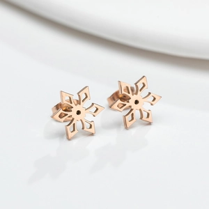 Elegant rose gold snowflake geometric stud earrings with polished finish on white background