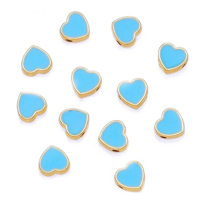 Macro shot of 8mm light blue enamel heart beads with gold-plated edges for DIY jewelry