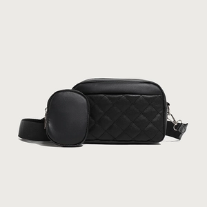 Chic black quilted crossbody camera bag with detachable round coin purse and wide strap