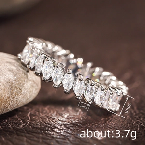 Macro shot of marquise-cut eternity ring showing 2mm by 5mm stone specs and 3.7g weight