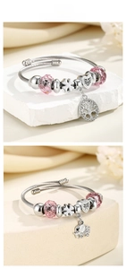 Detail of adjustable crown bracelets with pink crystal beads and silver elephant charms