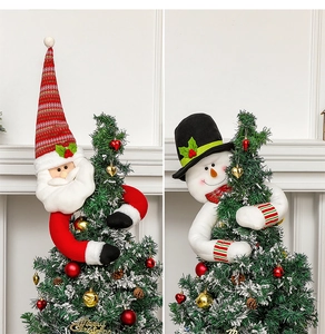 Detail of Santa and Snowman plush Christmas tree toppers for festive home decor