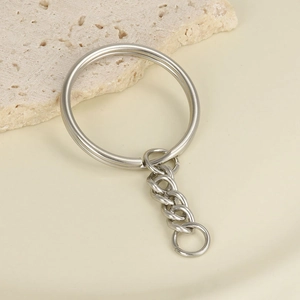 Close-up of a silver stainless steel key ring with a connecting chain link detail