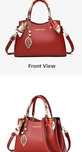 Detail view of dark red lychee leather handbag with silk scarf handle and golden leaf charm