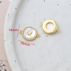 Detailed view of 14mm shell butterfly connector with zircon stones and sizing info