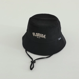 Detail of waffle texture fabric and Florida embroidery on a black kids bucket hat