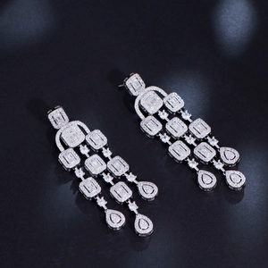 Detailed close-up of luxurious silver chandelier earrings featuring cascading zircon tassels