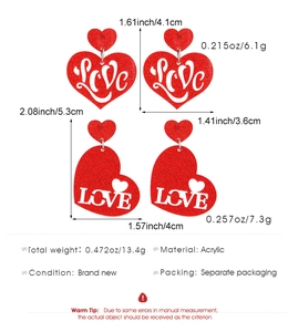 Red glitter acrylic heart earrings with LOVE cutout design and specific dimensions