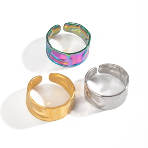 Three adjustable hammered texture wide metal rings in aurora purple, gold, and silver finishes