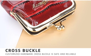 Detail of burgundy crocodile pattern coin purse with golden cross buckle hardware