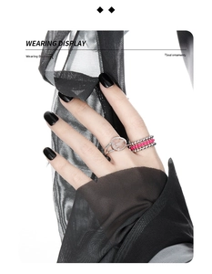 Detail of S925 silver multi-layer bead ring set with pink accents on female hand