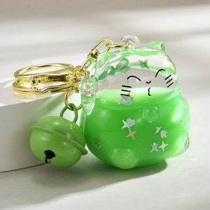 Green lucky cat liquid quicksand keychain with moon sequins and gold bell accessory