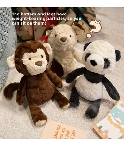 Detail of plush toys with weighted beads for stable sitting in monkey panda and dog styles