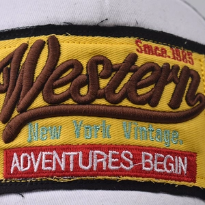 Retro Western adventures embroidery patch on yellow base for a vintage baseball cap