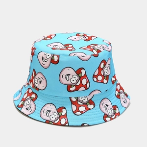 Detail of blue reversible bucket hat with red polka dot mushroom pattern and clean stitching