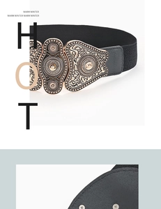 Macro detail of retro gold carved buckle and snap closure on black elastic wide waist belt