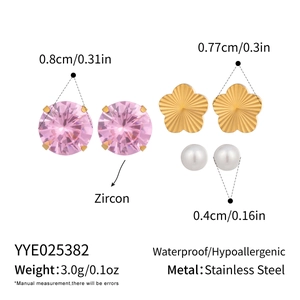 Detailed view of zircon, stainless steel flower, and pearl stud earrings set with sizes
