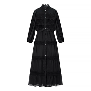 Detail of elegant black long dress with lace stitching and button-down bodice