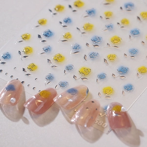 Autocollants nail art 3D roses jaunes et bleues avec bordures dorées effet bronzant