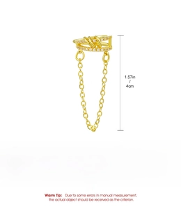 Detailed view of a gold-toned rhinestone ear cuff with tassel chain showing 4cm length