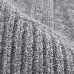 Close-up of premium thick ribbed knit texture in grey wool for winter warm beanie hat