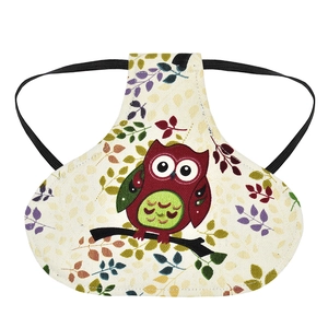 Detail view of canvas poultry hen saddle featuring owl prints and elastic straps