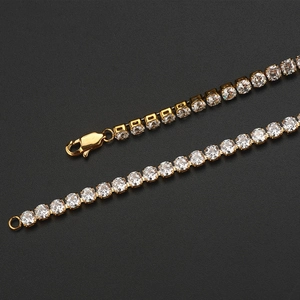 Close-up of a gold-plated hip hop tennis chain with shimmering round cubic zirconia stones
