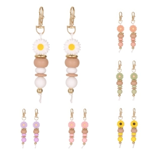 Handmade beaded daisy flower keychains in multiple colors with gold metal clasps