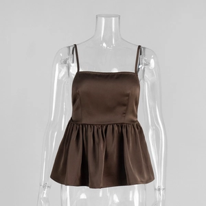 Detailed view of brown satin camisole with adjustable straps and ruffled peplum hemline