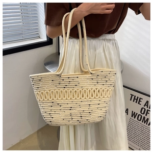 Detail of large woven cotton tote bag in cream white featuring fine wave texture design