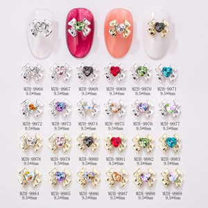 Detail view of 24-color alloy bow nail art charms with heart rhinestones 9.5x8mm size