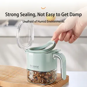 Green flip-top glass spice jar with airtight seal and ergonomic handle for kitchen storage