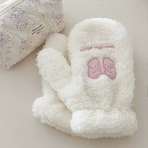 Detailed embroidery on plush white gloves featuring pink bows and sweet lettering