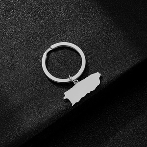 Detailed close-up of polished silver stainless steel Puerto Rico map pendant keychain