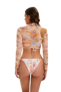 Detail of sheer long sleeve mesh cover-up with abstract artistic print and back tie closure
