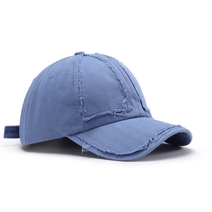 Vintage washed light blue baseball cap with distressed frayed edges and adjustable strap
