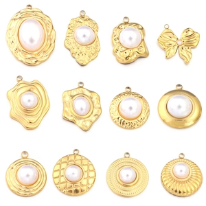 Macro shot of 12 assorted gold-plated sunflower pearl pendants for DIY jewelry making