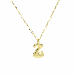 Close-up of polished 18k gold plated bubble 26 letter Z pendant necklace on white background