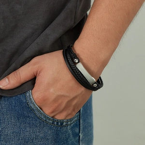 Fashionable multilayer woven black leather bracelet with a polished stainless steel tag