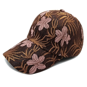 Close-up of floral lace embroidery and detailed mesh texture on a stylish baseball cap