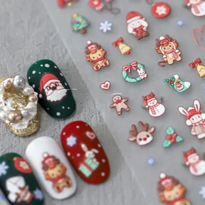 Detailed Christmas nail stickers featuring Santa and reindeer on matte red and white nails