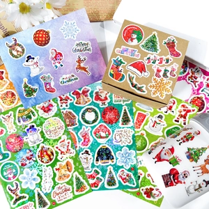 Close-up of Merry Christmas stickers applied on gift boxes and envelopes for decoration