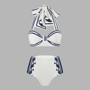 Detail of nautical halter bikini top with large bow and high-waisted fish print bottom