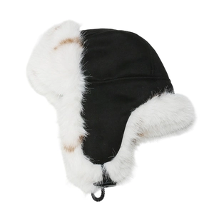 Detailed close-up of thick faux fox fur lining and buckle on a warm trapper hat